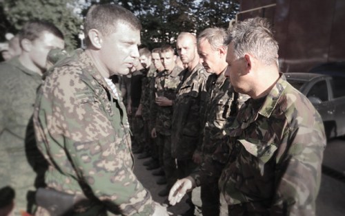 "The Prime Minister of the DPR, Aleksandr Zakharchenko, walks out in front of the line of prisoners." Photo: Aleksandr KOTS Dmitriy STESHIN